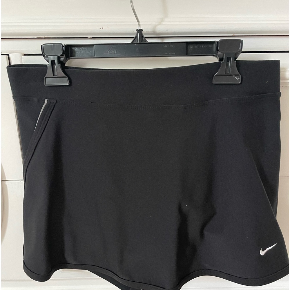 Nike tennis or pickleball skirt. Lined with pocket in back.